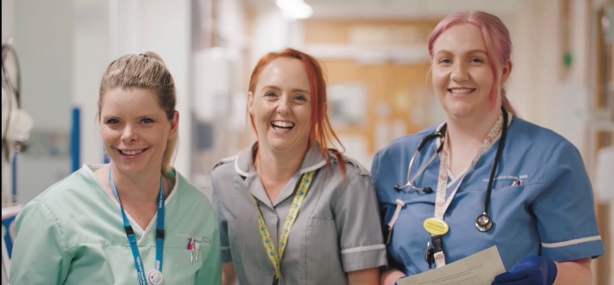 Three student nurses smiling