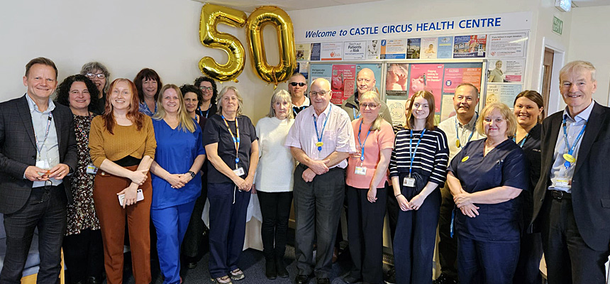 CEO, Joe Teape, and Chair, Chris Balch, with colleagues at Castle Circus Health Centre celebrating 50 years since the building opened.